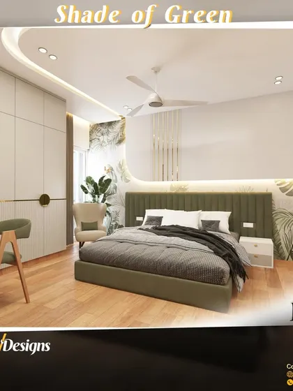 A green accent wall and matching upholstered bed create a peaceful atmosphere in this bedroom design. The look is complemented by wooden flooring and botanical-print wallpaper, bringing the serenity of the outdoors inside.