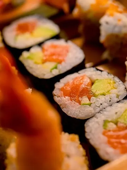 A close-up of fresh salmon and avocado sushi rolls, a testament to our quality ingredients.