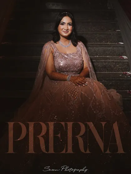 A seated portrait of the bride on a staircase, with her name elegantly displayed on the image.