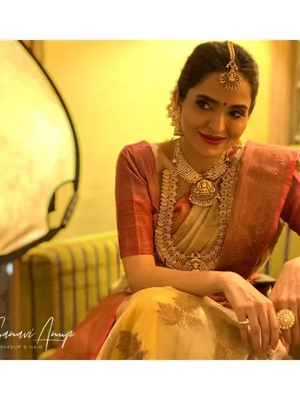 Another angle of this elegant traditional look, showing how the makeup looks flawless even with professional lighting.