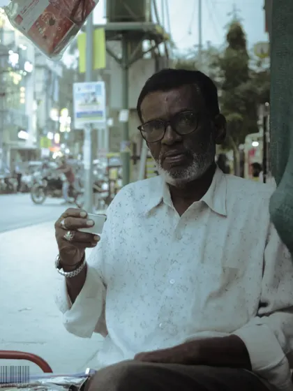 A man enjoying his chai at a roadside stall. These are the simple, authentic moments I love to capture, reflecting the true culture of the city.