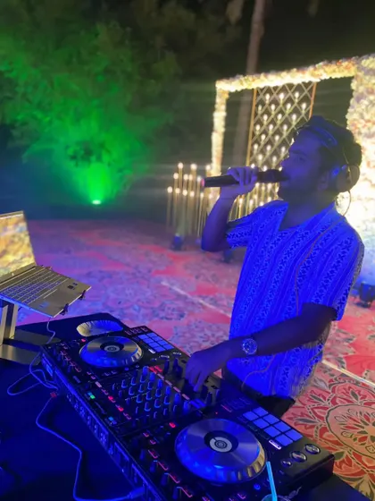 Here I am on the mic at an outdoor event. Engaging with the audience directly is a huge part of my performance style, especially when dealing with large, open-air crowds.