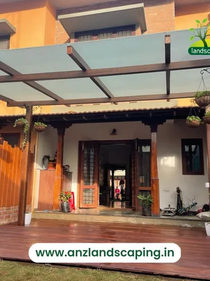 A frontal view of the villa extension, showing how the pergola seamlessly connects the home's interior with the newly designed outdoor deck and garden.