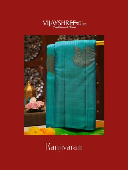 A beautiful teal Kanjivaram with large paisley motifs in silver zari.