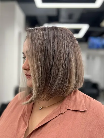 A side view of the ash blonde bob, highlighting the clean lines and the subtle, cool-toned highlights.