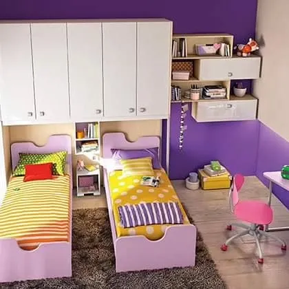 A space-saving design for a shared children's room, with twin beds and an overhead wardrobe and shelving unit to maximize storage.