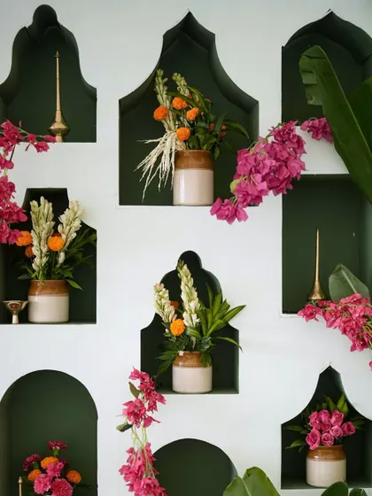 Nostalgic Indian wedding details, using traditional pickle jars (barni) as vases for marigolds and tuberoses.