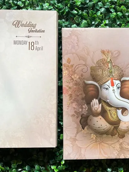 This card features a beautiful 3D Ganesha idol set against a soft floral background. It's a perfect way to seek blessings for your new beginning.
