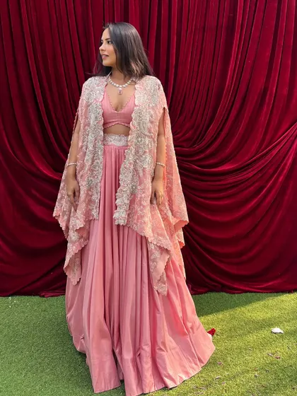 A picture-perfect day in a picture-perfect outfit. I loved wearing this pink skirt and crop top with an embroidered cape for a day wedding.