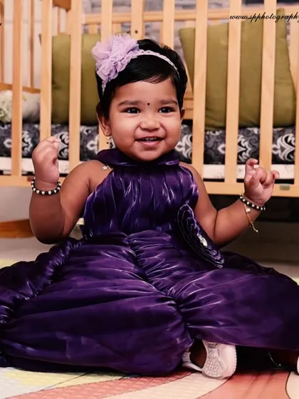 Our RR Nagar studio is equipped with various props, including this classic wooden crib, to create a charming and safe setting for your baby's photoshoot.