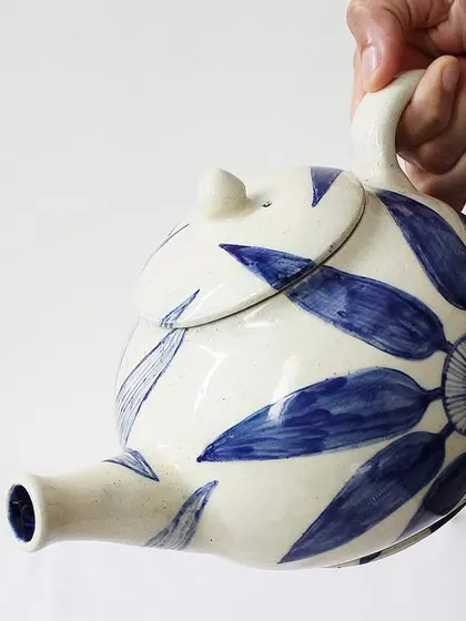 My 'Bloom & Brew' teapot is designed for those who cherish their tea rituals. The bold, hand-painted indigo florals on the off-white ceramic body turn a simple daily routine into a moment of beauty and slow living.
