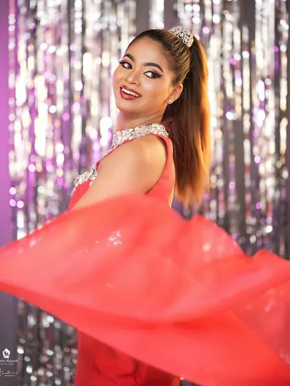 A fun, dynamic shot that shows the makeup looks great even with movement and a big smile.