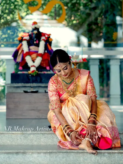 A candid shot of the bride during her wedding photoshoot. The makeup is designed to look flawless both in person and in professional photographs.