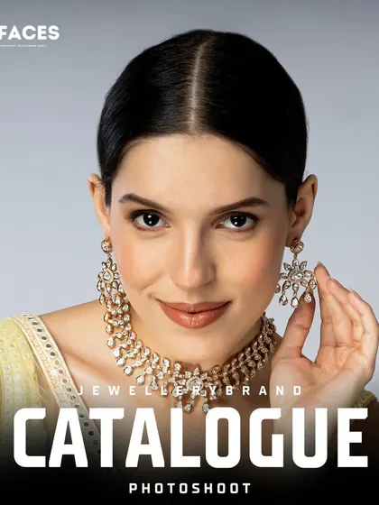 The model holds up a delicate earring, drawing focus to a beautiful diamond necklace and earring set, ideal for a detailed product shot.