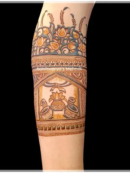 A close-up of a traditional kalash design on the arm, a symbol of prosperity often included in bridal mehndi.