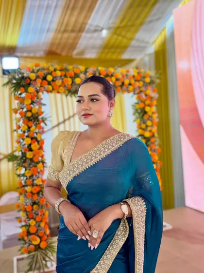 A poised look in a beautiful blue saree at the Naman Industrial Park event. My attire is always chosen to complement the event's theme and formality.
