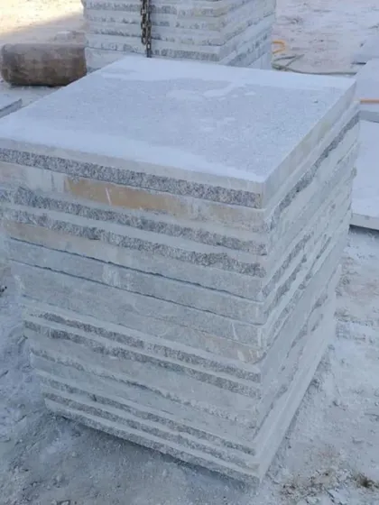 A stack of square-cut paving stones.