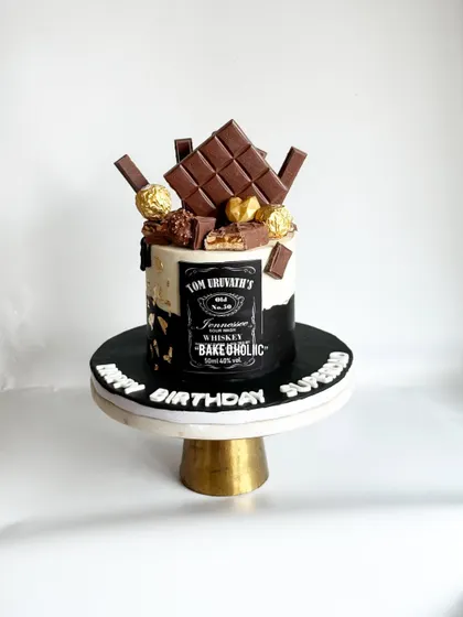 A Jack Daniel's and chocolate-themed cake for a 50th birthday. This 1.5kg Belgian chocolate truffle cake is perfect for whiskey lovers.
