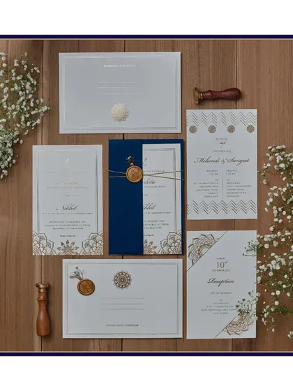 A beautiful rendition of our mandala-inspired design. This suite uses a calming palette of navy blue, white, and gold, with intricate mandala patterns and a custom wax seal to tie it all together.