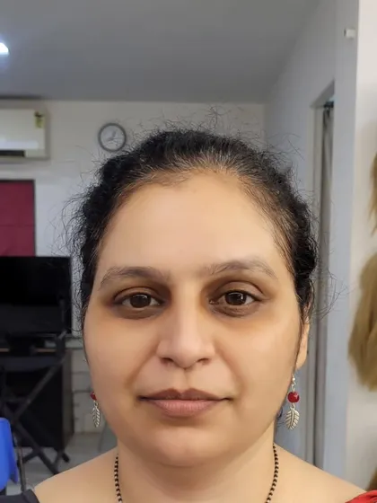 Before: My mother, ready for her classic smokey eye and red lip look.