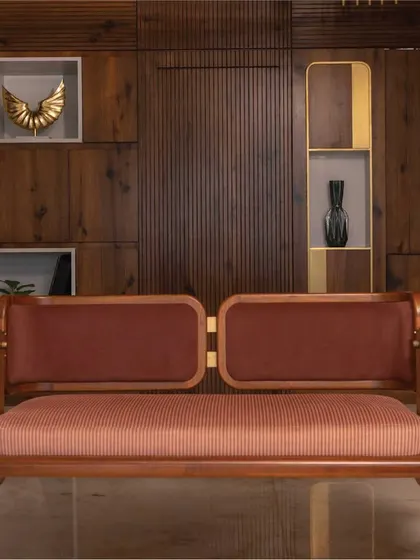 A closer look at the custom-designed reversible swing, a signature piece from my 'Objects by Soch' collection. This piece exemplifies my commitment to craftsmanship, combining the warmth of teak wood with elegant brass fixtures and plush upholstery to create functional art.