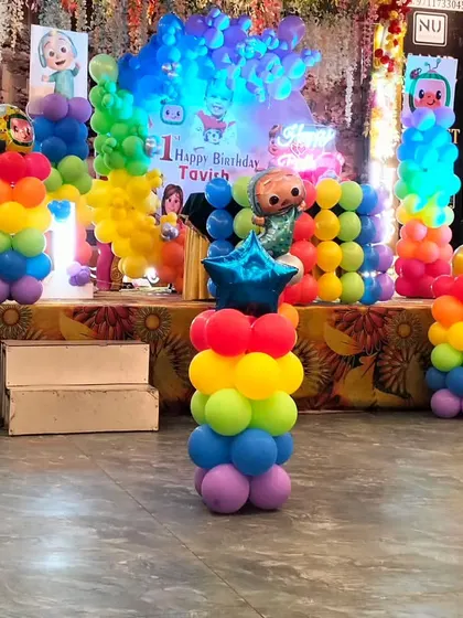 Another angle of the Cocomelon party stage, focusing on the colorful balloon pillars and character details. I use different shades to create a visually rich and exciting setup for the kids.