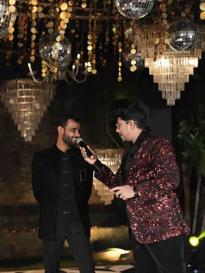 Interacting with the groom during the Sangeet. These one-on-one moments on stage help build a connection and bring out the couple's personality for all the guests to see.