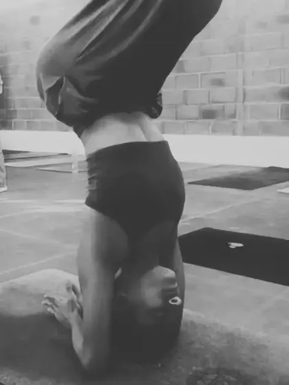 Finding my center in a forearm headstand during a profound trip to Mysore. Inversions like this challenge our perspective and build strength, focus, and tranquility.