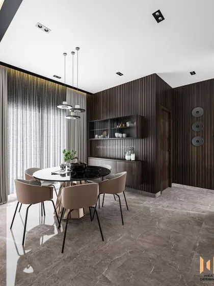 A luxurious living and dining space featuring dark fluted wooden panels, imported granite flooring, and a sleek 6-seater round dining table.