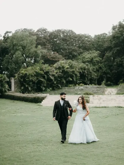 A classic walking shot in a beautiful garden. This engagement photo feels like a stroll from a romantic movie.
