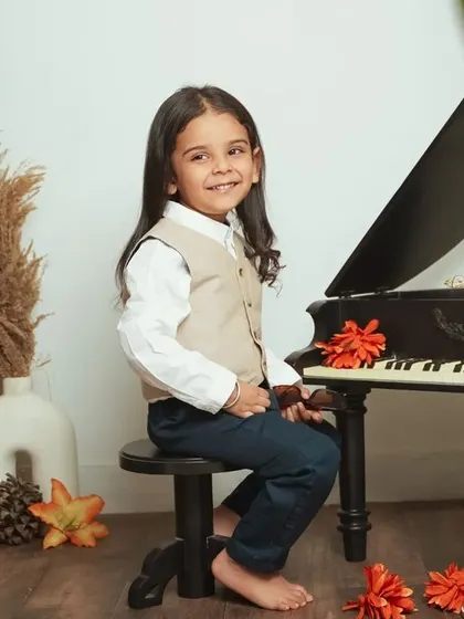 A full view of our vintage piano setup, perfect for capturing timeless portraits of your child.