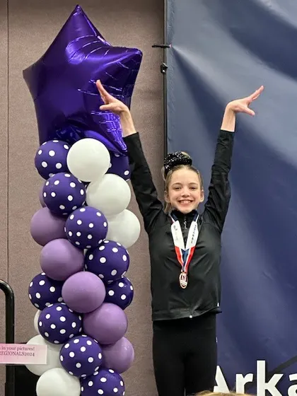 Celebrating a great performance and a personal best score at Level 7 Regionals.