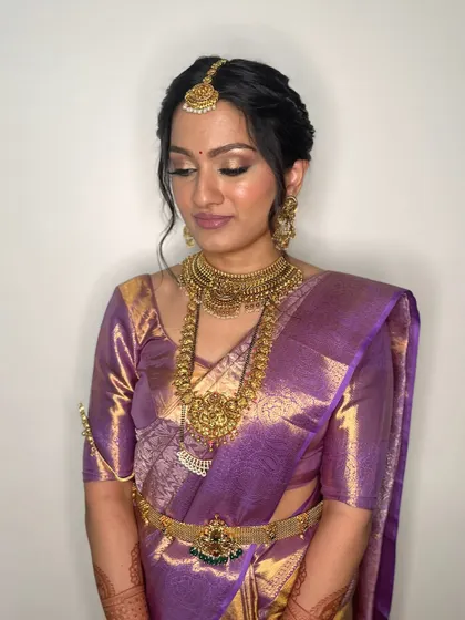 The bride looking serene and elegant. The soft glam makeup enhances her features without overpowering her natural beauty.