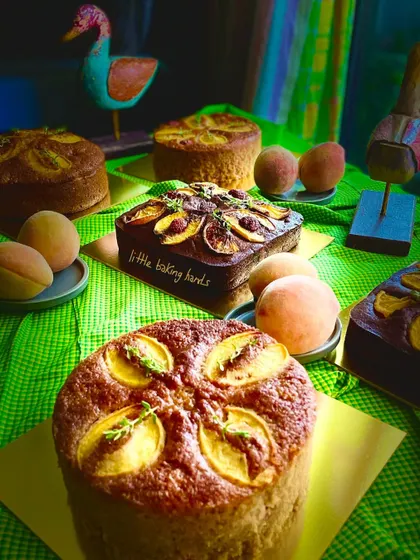 Peach cakes, many ways. 'Tis the season. This photo shows a beautiful spread of different peach cakes I've baked, from round to square, some with thyme, some with chocolate.