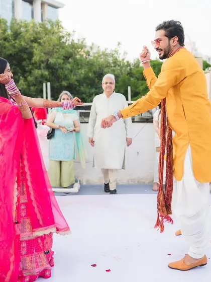 A fun dance-off at a vibrant Mehendi party. We believe every wedding event should be filled with music, laughter, and plenty of dancing.