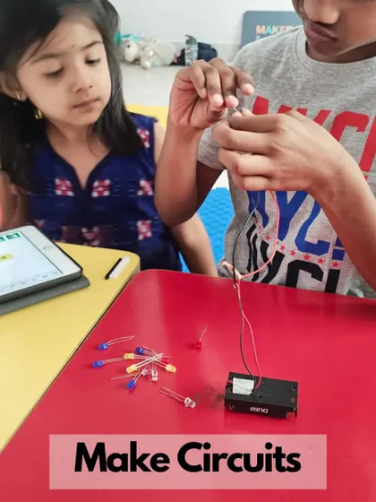 A duplicate of ID 238, showing kids learning about circuits and electronics in a collaborative environment.