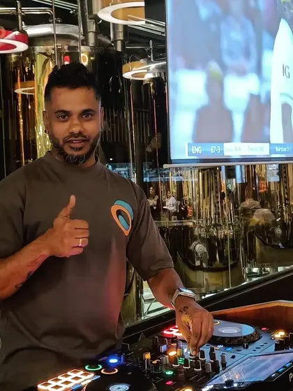 A quick thumbs-up during a set at a brewery. It's all about feeling good and living better, and I try to bring that positive energy to every gig.