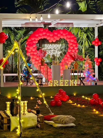 The same romantic garden party setup, showing how the decorations create a magical glow at night.