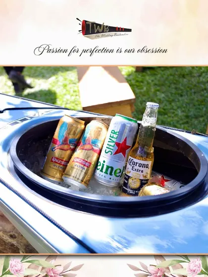 A creative way to keep beers cold and accessible at a sunny Alibag brunch, using a kayak as an ice bucket.