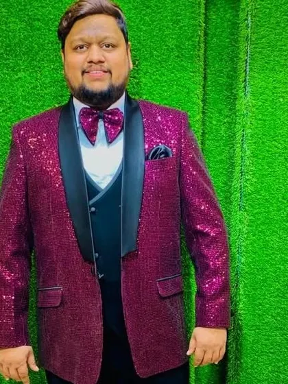 A client shining bright in our magenta sequin tuxedo jacket. This is the ultimate party wear piece.