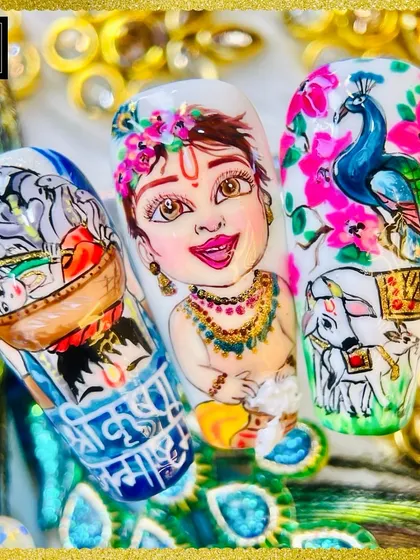 Our Janmashtami special nail art, featuring a beautifully hand-painted portrait of little Krishna, a peacock, and other traditional motifs.