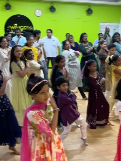 The whole studio, including parents and kids, grooving together during our Diwali celebration. It's a wonderful showcase of our vibrant and inclusive dance community.