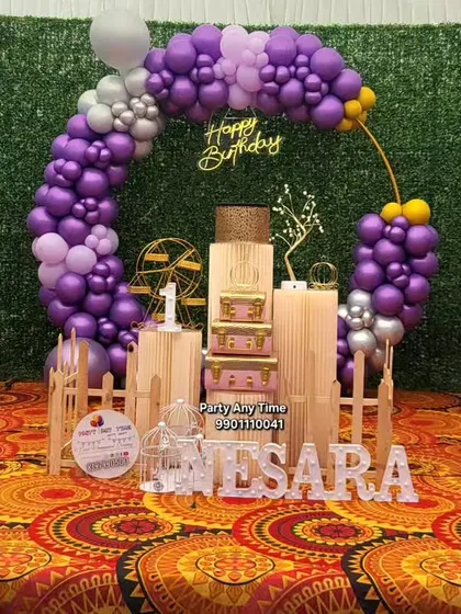 The full view of the purple and silver first birthday decoration for Nesara.