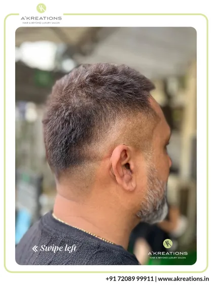 This clean, classic men's haircut features a subtle fade that tapers neatly at the neckline, offering a sharp and professional finish.