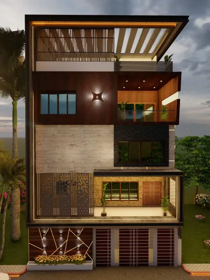 A front view of the Nagarbhavi residence, capturing the sunset reflecting in the windows and the warm glow of the integrated lighting.