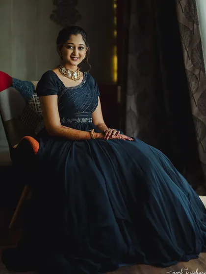 A full-length shot showing the princess-like silhouette of her welcome event gown.