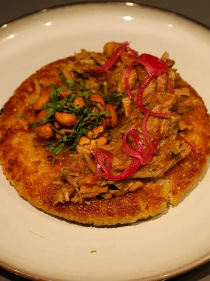 A crispy rice cake topped with pulled pork and pickled onions, another inventive plate from the Grumps, Goa pop-up.