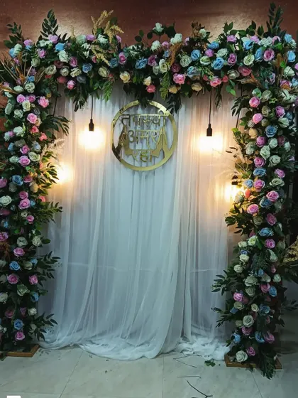 A lush and beautiful arch made entirely of colorful flowers and greenery. This stunning floral decoration is perfect for creating a grand and natural entrance or backdrop.