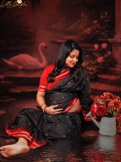 Draped in traditions and glowing with joy. This creative portrait combines a traditional saree with a fantasy water-themed backdrop for a unique and artistic look.