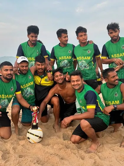 A group of Assam players with a makeshift trophy after a fun game on the beach. Keeping the competitive spirit alive even during downtime.